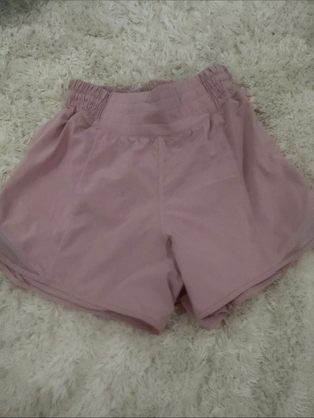 Women’s lululemon pink shorts (last name written inside)